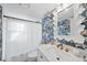 Charming bathroom featuring a marble countertop, decorative wallpaper, and classic fixtures at 4708 Sweetbriar Dr, Raleigh, NC 27609