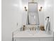 Chic bathroom with marble countertops, gold fixtures, and elegant sconces at 4708 Sweetbriar Dr, Raleigh, NC 27609