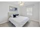 Bright bedroom featuring a comfortable bed and a large window at 4708 Sweetbriar Dr, Raleigh, NC 27609