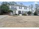 Charming two-story white brick home featuring manicured landscaping and a welcoming entrance at 4708 Sweetbriar Dr, Raleigh, NC 27609