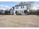 Charming two-story white brick home featuring manicured landscaping and a welcoming entrance at 4708 Sweetbriar Dr, Raleigh, NC 27609