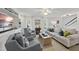 Bright living room featuring built-in shelving, comfortable seating, and natural light at 4708 Sweetbriar Dr, Raleigh, NC 27609