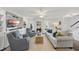 Bright living room featuring built-in shelving, comfortable seating, and natural light at 4708 Sweetbriar Dr, Raleigh, NC 27609