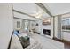 Spacious living room with exposed beams, a cozy fireplace, and comfortable seating at 4708 Sweetbriar Dr, Raleigh, NC 27609