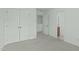 Bedroom with neutral carpet, double closets and access to an ensuite bathroom at 4821 Heathshire Dr, Raleigh, NC 27616