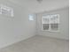 Bright, carpeted bedroom with windows offering natural light at 4821 Heathshire Dr, Raleigh, NC 27616