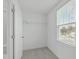 Walk-in closet with wire shelving and a window, providing ample storage space at 4821 Heathshire Dr, Raleigh, NC 27616