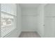 Bright walk-in closet with window and shelving offering practical storage solutions at 4821 Heathshire Dr, Raleigh, NC 27616