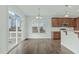 Open dining area with sliding glass doors to a wooden deck for outdoor enjoyment at 4821 Heathshire Dr, Raleigh, NC 27616