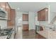 Updated kitchen boasts stainless steel appliances and granite countertops at 4821 Heathshire Dr, Raleigh, NC 27616