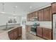 Eat-in kitchen with stainless appliances, granite countertops, and tile backsplash at 4821 Heathshire Dr, Raleigh, NC 27616