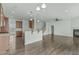 Open layout shows the transition from dining area to living room with fireplace at 4821 Heathshire Dr, Raleigh, NC 27616