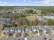 Aerial view of neighborhood showcasing the community and surrounding trees at 500 Skygrove Dr, Holly Springs, NC 27540