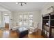 Cozy reading area with plush seating, a bookshelf, and ample natural light at 500 Skygrove Dr, Holly Springs, NC 27540