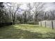 Large, well-maintained backyard with mature trees and partial fencing at 510 Short W St, Hillsborough, NC 27278