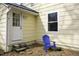 Exterior view of home with a yellow wall, white trim, and blue chair at 510 Short W St, Hillsborough, NC 27278