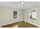 Bedroom with two windows, natural light, and neutral paint at 510 Short W St, Hillsborough, NC 27278