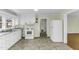 Kitchen features a stainless sink, white cabinets, and updated appliances at 510 Short W St, Hillsborough, NC 27278