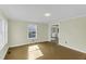 View of the living room with hardwood flooring leading to the laundry area at 510 Short W St, Hillsborough, NC 27278