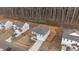 Aerial view of the house and the surrounding neighborhood landscape, including trees and other homes at 538 E Waycliff Rd, Henderson, NC 27537