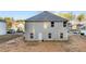 Exterior view of home showcasing backyard with a two-story design and ample natural light from the windows at 538 E Waycliff Rd, Henderson, NC 27537