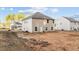 Exterior view of home showcasing backyard with a two-story design and ample natural light from the windows at 538 E Waycliff Rd, Henderson, NC 27537