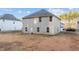 Exterior view of house with neutral siding, a door, and a spacious backyard for various activities at 538 E Waycliff Rd, Henderson, NC 27537
