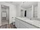 Bathroom featuring double vanity with granite countertop and wood-look flooring at 538 E Waycliff Rd, Henderson, NC 27537