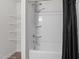 Modern bathroom featuring a shower and tub combo with black curtain at 538 E Waycliff Rd, Henderson, NC 27537