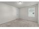 Bedroom featuring neutral walls, carpeted floor, and a single window at 538 E Waycliff Rd, Henderson, NC 27537