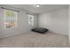 Cozy bedroom with neutral carpet, natural light from two windows, and a pillow at 538 E Waycliff Rd, Henderson, NC 27537