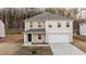 Charming two-story home with a covered entryway and an attached garage at 538 E Waycliff Rd, Henderson, NC 27537