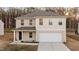 Charming two-story home with attached garage and well-maintained landscaping at 538 E Waycliff Rd, Henderson, NC 27537
