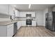 Modern kitchen showcasing white cabinets, stainless appliances, and stone countertops at 538 E Waycliff Rd, Henderson, NC 27537