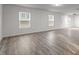 Expansive living room showcasing luxury vinyl plank flooring and natural light at 538 E Waycliff Rd, Henderson, NC 27537