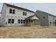 View of the unfinished backyard featuring a covered porch and the home's rear exterior at 544 Jocund St # 16, Rolesville, NC 27571