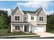 Charming two-story home with brick accents, gray siding, an attached garage, and a welcoming front porch at 544 Jocund St # 16, Rolesville, NC 27571