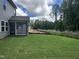A spacious lawn with newly installed landscaping, provides a serene backyard setting at 548 Jocund St # 15, Rolesville, NC 27571