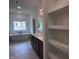 Bathroom featuring tub, double sink vanity with countertop, and storage shelving at 548 Jocund St # 15, Rolesville, NC 27571