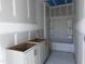 New bathroom featuring white vanity cabinets with a tub and shower at 548 Jocund St # 15, Rolesville, NC 27571