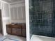 Bathroom showcasing a tiled shower and vanity with gray tile flooring at 548 Jocund St # 15, Rolesville, NC 27571