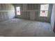 A bedroom with two windows prepared for finishing work at 548 Jocund St # 15, Rolesville, NC 27571