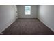 A light-filled room features plush carpet and a neutral palette, creating a serene space at 548 Jocund St # 15, Rolesville, NC 27571