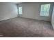 Spacious bedroom with fresh carpet, freshly painted walls, and natural light from two windows at 548 Jocund St # 15, Rolesville, NC 27571