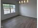 Bright dining room with a large window and modern chandelier, ready for elegant meals at 548 Jocund St # 15, Rolesville, NC 27571