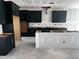 Kitchen area with dark cabinetry, gold hardware, and open shelving for appliances at 548 Jocund St # 15, Rolesville, NC 27571