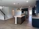 Open layout showcases the kitchen island and stainless appliances, adjacent to the living area at 548 Jocund St # 15, Rolesville, NC 27571