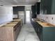 View of the kitchen featuring an island and modern dark and wooden cabinets at 548 Jocund St # 15, Rolesville, NC 27571