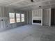 Spacious room featuring a fireplace and large windows providing natural light at 548 Jocund St # 15, Rolesville, NC 27571