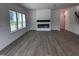 Spacious living room featuring a modern fireplace and ample natural light from large windows at 548 Jocund St # 15, Rolesville, NC 27571